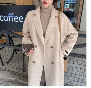 Reversibel kashmirrock kvinnors mittlängd 2021 höst och vinter ny koreansk stil hepburn stil kokongformad drop-shoulder ullrock för kvinnor