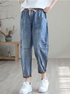 Kvinnors jeans koreanska version fashionabla rippade nio-poäng kvinnor lossa tunna och elastiska midja avslappnade stora byxbyxor för