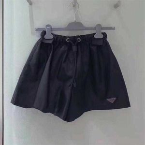 Tasarımcı Kadın Giysileri% 20 İndirim Gömlek Sıradan Üçgen Drawstring Naylon Şort 23 Yaz Gevşek İnce Yüksek Bel Geniş Bacak Pantolon