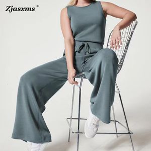 Kvinnors jumpsuits Rompers Spring Solid Slim Back Button OL Jumpsuit Summer O Neck Sleeveless Tank PlaySuit Women Drawstring Straight Pants Romper Overalls 230410