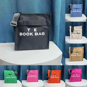 Bolsa de grife primavera 2023 nova bolsa escolar popular tendência de moda larga ombro crossbody saco versátil bolsa de ombro único