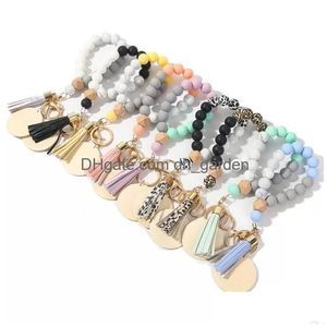 Key Rings 2022 New Designer Monogram Personalized Silica Bead Wood Chip Bracelet Key Ring Tassel Drop Delivery Jewelry Dhgarden Dhiuo