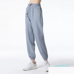 Strój jogi Lu wiosna i jesień Quickdrying Sports Womens 35 Leggings Spodnie biegające na fitness swobodne LU9018 Sprawdź T Dhqz5