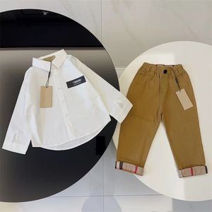 2023 Baby Children's Clothing Designer Boy Plaid Shirt Girl Plaid Spódniczka modowa garnitur wiosenny i letni garnitur na długim rękodzie 100-150 cm M21