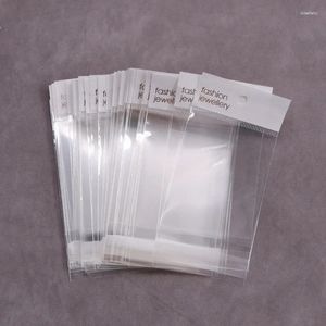 Bolsas de jóias 100 pcs branco transparente auto-selagem sacos de opp com furo de suspensão para brinco colar embalagem display fornecedor