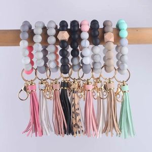 Keychains Charm Leather Silicone Tassel Wood Pärlor Armband för kvinnor Keychain Ring Mobiltelefonbil Ryggsäck Pendantskedjan Tillbehör