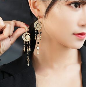 Dangle & Chandelier Moon shaped star pendant with diamonds and long tassel earrings