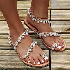 Sandaler kvinna sommarskor 2023 mode romersk platt tofs pärla strand korsband stor storlek
