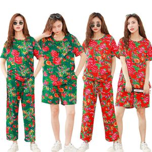 Abbigliamento etnico New Hot Paris Designer Street Netflix Moda Abbigliamento femminile Nord-est Grande fiore mascotte Abito rosso Dance Village Girl Fried Street Style