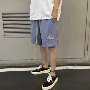 メンズショーツRhude Summerデザイナービーチパンツ通貨バスターRhude春と夏刺繍ハイストリートドローストリングカジュアルカップルスポーツカプリ