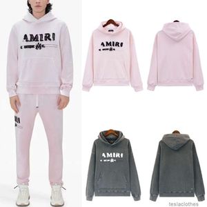 Felpa con cappuccio firmata Felpe da uomo Moda Streetwear Amires 23 Nuova lettera floccata Logo Stampa sfumata Maglioni da donna allentati con cappuccio Moda autunno inverno