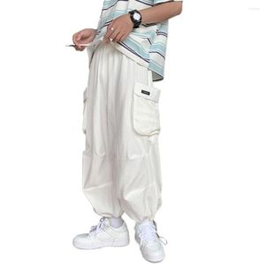 Calça masculina masculina carga de cordão elástico Banco de bolsos grandes homens solto de hip hop lide as calças de perna larga