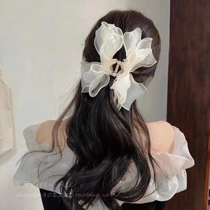 مقاطع الشعر barrettes 2023 نساء النجمة القوس بونيل ذيل الشريط مرنة العصابات الحرير الساتان scrunchie روابط حصص ذيل حصان