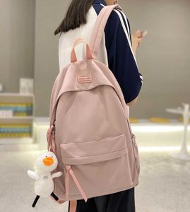 Sevimli kız pembe okul çantaları kadın serin kolej öğrenci sırt çantası kawaii kadın moda çantası su geçirmez naylon bayanlar sırt çantası moda y1411897