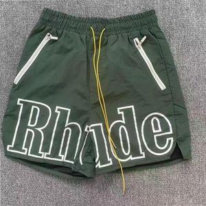 Mens shorts Summer High Quality Rhude Panel Logo Short Women Designers Byxor rörelse Pants Fashion Quick Torking Beach Pants S3