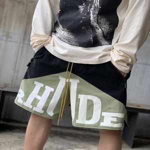 Дизайнерская одежда короткие повседневные шорты Rhude Мужские баскетбольные штаны с пятью точками High Street Свободные спортивные тренировки Trend Street Summer Joggers Спортивная одежда