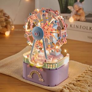 Blocos Ferris Wheel Music Box Bricks Modelo Conjunto DIY Building Block Amusement Park Carrossel com Light Kid Toy Mini Partícula Construção 231121