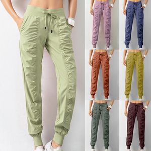 Spodnie damskie Capris Women Dresstring Sports Uruchamianie sportowych joggerów Szybkie suche sportowe spodni fitness z dwoma bocznymi kieszeniami Spodnie 230421