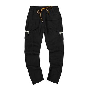 Designer Clothing Casual Pant Roaring Small Eyes Rhude Copper Ammonia Velvet Cloth Pill Zipper Multi Bag High Street Overalls Cargo Pants outdoor Loose Hip hop