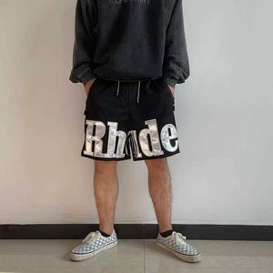 Roupas de grife curto casual rhude shorts high street tendência de tendência de couro bordado multi bolso de bolso esportes casuais capris homens correndo fitness