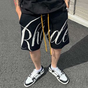 Ropa de diseñador Rhude American Trend Brand Letter Jacquard Knitted Wool Loose Casual Sports Shorts Hombres Mujeres en verano Parejas Joggers Ropa deportiva