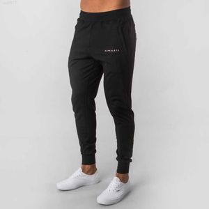 Alphalete New Style Mens Brand Jogger Sweatpants Man Gyms Workout Fitness Cotton Trousers Male Casual Fashion Skinny Track Pantsschq