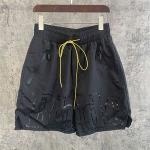 Designerkläder High Street Rhude Bokstavstryck Nisch Shorts i mörk stil med femdelade byxor Populära sportbyxor för män Löst sittande par Joggare Sportkläder