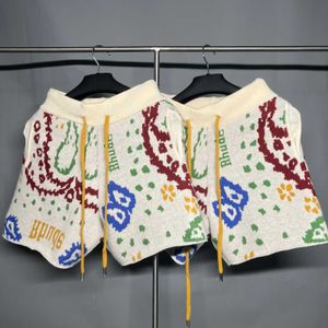 Abbigliamento firmato Rhude jacquard goffrato anacardi motivo floreale lana americana per il tempo libero lavorato a maglia pantaloncini da vacanza al mare coppie jogging abbigliamento sportivo