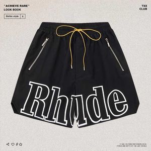 Designerkläder Rhude American High Street-skylt Brevtryckt Beach Capris Dubbellager Snabbtorkande Herr Dam Lösa Fritidsshorts Par Joggare Sportkläder