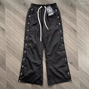 Pantaloni da uomo Hellstar Studios Designer da uomo con bottoni in nylon cerato