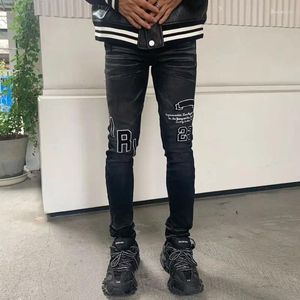 Mens jeans mode streetwear män knappar flyger retro svart grå stretch mager fit rippad lapp designer hip hop byxor