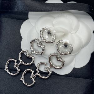 Design heart shaped women's long dangle earrings, fashion hollow set diamond ladies earrings wholesale gifts for friends