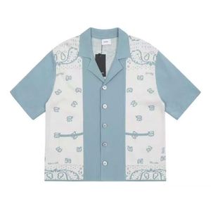 T-shirt firmate di abbigliamento di moda Magliette Rhude Pannello di fiori di anacardi Maglia polo jacquard lavorata a contrasto da uomo T-shirt manica corta cardigan allentato casual da donna