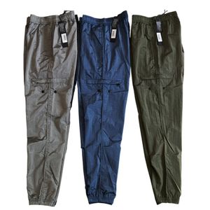 Pantaloni da uomo Top primavera ed estate Bussola ricamo pantaloni casual da uomo in nylon metallico pantaloni riflettenti in nylon metallico per uomo donna 230425