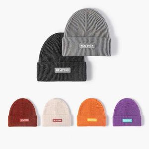 Caps Knitted hats for women autumn and winter outdoor Korean letters fashionable brimless men's cold hats round tops black face revealing small wool hats