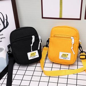 2023 Canvas Feminina Bolsa Crossbody Trend Trend ombro Bola de ombro coreano Cor de cor sólida Student Saco de telefone Simples Shopper Zipper Purse