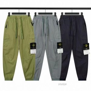 Designer Stones Island Solid Color Pants Multi Big Pocket Overalls Byxor Spring och Summer New Fashion Brand Retro Men's Jogging Leggings Mens