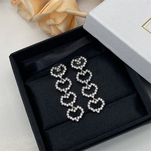 Design heart shaped women's long dangle earrings, fashion hollow set diamond ladies earrings wholesale gifts designer jewelry with logo DHL free