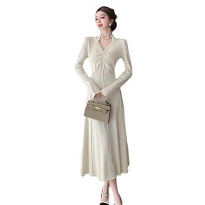 Super good-looking halterneck long-sleeved V-neck knitted dress women's autumn and winter new waist cinching thin temperament with long skirt tide inside