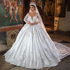 2024 Luxury Princess Satin Ball Gown Wedding Dress Lace Pearls Pärlade långa ärmar Sheer Neck White Brudklänning Vestido de Novia