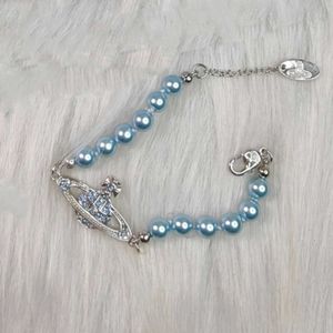 Designer Viviane Westwood New Viviane New Western Empress Dowager Blue Saturn Pearl Necklace Armband örhängen Personlig enkel blå diamant komplex