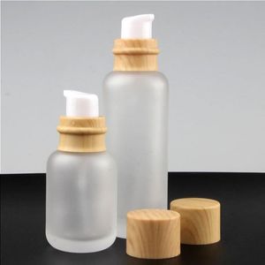 Frosted Glass Cream Flaskor Runt kosmetiska burkar Hand Face Lotion Pump Bottle With Wood Cap GPFOT