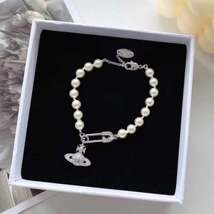 Designer vivienen Westwoods New Viviane Ansey Empress Dowager Saturn Pearl Brooch Bracelet Female Ins Minority Highgrade Light Luxury Versatile Fashion