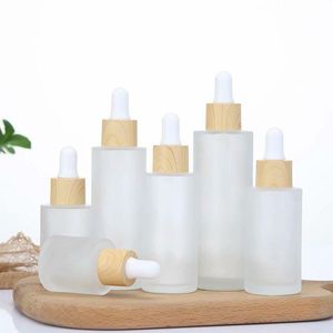 Mattierte Klarglas-Tropfflasche, ätherisches Öl, Parfüm, Kosmetik, Verpackungsflaschen mit imitiertem Holzdeckel, 20 ml, 30 ml, 50 ml, 60 ml, 100 ml Vjrbc