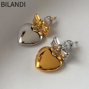 Stud bilendi 925 Gümüş İğne Asimetrik Pürüzsüz Metal Bowknot Kalp Küpe Kadın Mücevherleri Kıdemli Sense Tatlı Kore Tasarım 231127