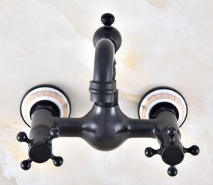 Rubinetti da cucina Rubinetto per lavabo a parete in bronzo lucidato a olio nero Base in ceramica Rubinetto per lavabo a parete Miscelatore con bocca girevole Doppi manici a croce Anf878