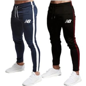 Calças masculinas marca casual calças magras dos homens joggers sweatpants treino de fitness marca calças de pista outono masculino moda calças 231129