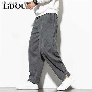 Pantaloni da uomo Primavera Autunno Nuovo colore solido Vintage Velluto a coste Pantaloni a gamba larga Uomo Tasche elastiche in vita Pantaloni casual All-match Abbigliamento L231129