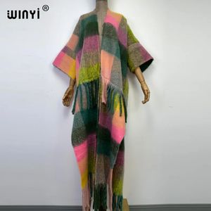 Women's Cape Winyi Winter Women Tassel Codzienna osobowość płaszcz swetra luźna sukienka szlafrok Longue gruby ciepły darmowy rozmiar Kaftan 231129