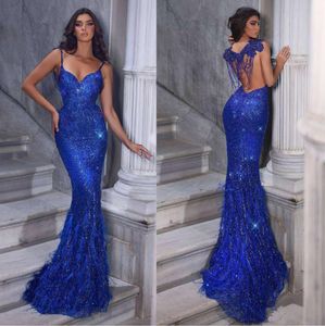 Sexig Royal Blue Prom Dresses Feather Spaghetti Stems paljetter bling bling aftonkl￤nningar skr￤ddarsydda robe de mariee